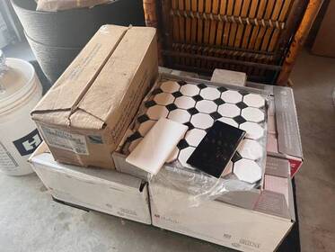 6 boxes of 3”x6” White Subway Tile, 1 1/2 Boxes Black and 1 Box of floor ti
